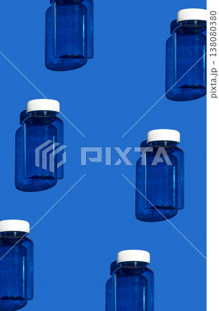 Medicine jar pattern on blue background, pharmaceutical flat lay texture top view Medicine jar pattern on blue background, pharmaceutical flat lay texture top view 138080380