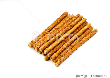 Crunchy sesame breadsticks isolated on white background 138080639