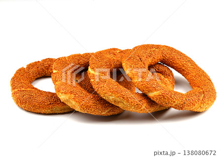Turkish traditional bagel / simit with sesame on white background, turkish breakfast pastry concept Turkish traditional bagel / simit with sesame on white background, turkish breakfast pastry concept 138080672