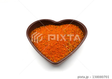 Cajun seasoning in a heart shaped bowl on a white background 138080701