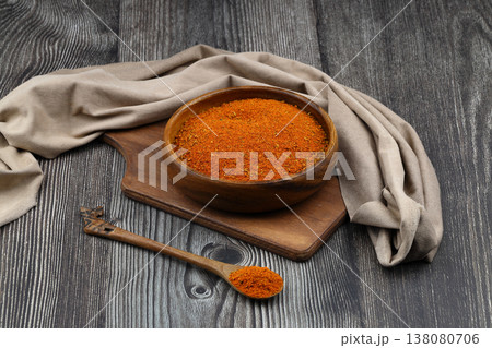 Cajun seasoning in a bowl on a dark wooden background Cajun seasoning in a bowl on a dark wooden background 138080706