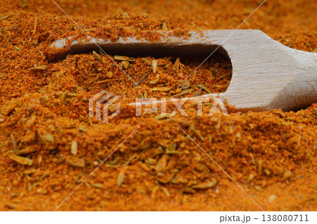 Full frame of Cajun seasoning texture with wooden scoop Full frame of Cajun seasoning texture with wooden scoop 138080711