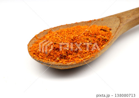 Cajun seasoning in a wooden spoon isolated on white background Cajun seasoning in a wooden spoon isolated on white background 138080713