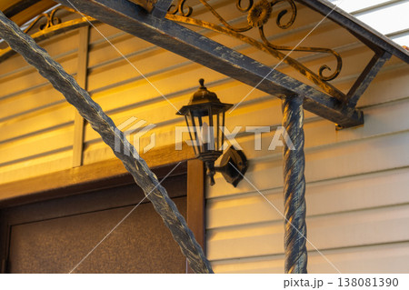 Aged polycarbonate canopy roof with metal beams, stained translucent covering showing wear and accumulated dirt debris Aged polycarbonate canopy roof with metal beams, stained translucent covering showing wear and accumulated dirt debris 138081390