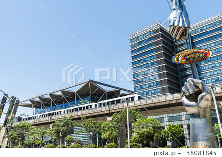 A train on the Wenhu or Brown Line of the Taipei MRT passes by the modern metropolis building in Nangang Software Park Area. A train on the Wenhu or Brown Line of the Taipei MRT passes by the modern metropolis building in Nangang Software Park Area. 138081845