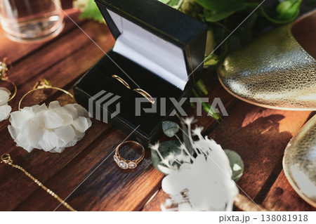 Wedding rings in velvet black box with floral details and accessories Wedding rings in velvet black box with floral details and accessories 138081918