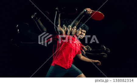Table tennis player in extended motion sequence in dark studio with large empty space Table tennis player in extended motion sequence in dark studio with large empty space 138082314
