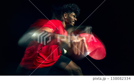 Table tennis player showing frustration during intense gameplay moment with motion blur. Table tennis player showing frustration during intense gameplay moment with motion blur. 138082334