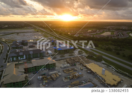 Top view of apartment buildings under construction in new developing suburban area. Development of residential housing in american suburbs. Real estate market in the USA Top view of apartment buildings under construction in new developing suburban area. Development of residential housing in american suburbs. Real estate market in the USA 138082455