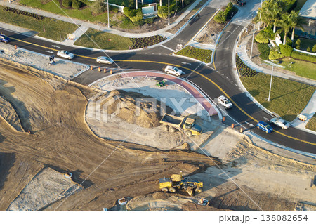 Roundabout construction roadworks on American transport infrastructure. Renovation of highway road with moving traffic. Development of interstate transportation concept Roundabout construction roadworks on American transport infrastructure. Renovation of highway road with moving traffic. Development of interstate transportation concept 138082654