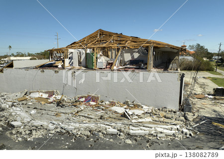 Natural disaster and its consequences. Hurricane Ian destroyed house roof and walls in Florida residential area Natural disaster and its consequences. Hurricane Ian destroyed house roof and walls in Florida residential area 138082789