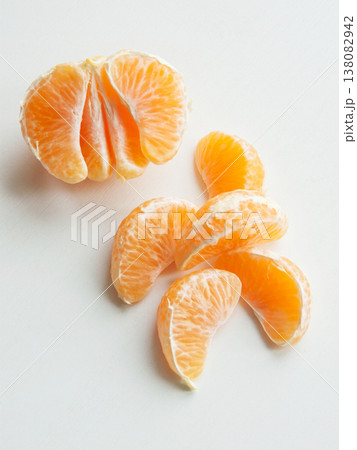 Fresh ripe tangerines on white background, juicy citrus orange fruits peeled lying on wooden table. 138082942