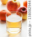Glass of fresh apple and orange mixed vitamin juice on table with fruits, sweet healthy beverage. 138082944
