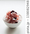 Shaved ice Kakigori granita berry dessert for summer made of ice with juice sauce in bowl on table. 138082948
