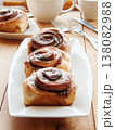 Sweet homemade cinnamon rolls with coffee for breakfast, freshly baked cinnabons with cream cheese. 138082988