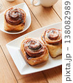 Sweet homemade cinnamon rolls with coffee for breakfast, freshly baked cinnabons with cream cheese. 138082989