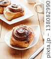 Sweet homemade cinnamon rolls with coffee for breakfast, freshly baked cinnabons with cream cheese. 138082990
