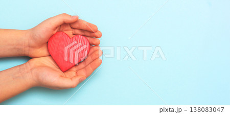 Kid holding heart shape in hand, healthcare Kid holding heart shape in hand, healthcare 138083047