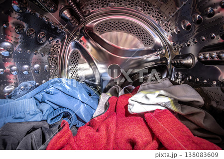 Washing machine drum with colorful clothes Washing machine drum with colorful clothes 138083609