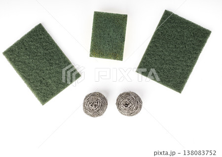 Set of Three Green Nylon Abrasive Scrubbing Pads and Two Stainless Steel Wire Wool Balls for Kitchen Dishwashing and Heavy-Duty Household Cleaning Isolated on White Set of Three Green Nylon Abrasive Scrubbing Pads and Two Stainless Steel Wire Wool Balls for Kitchen Dishwashing and Heavy-Duty Household Cleaning Isolated on White 138083752