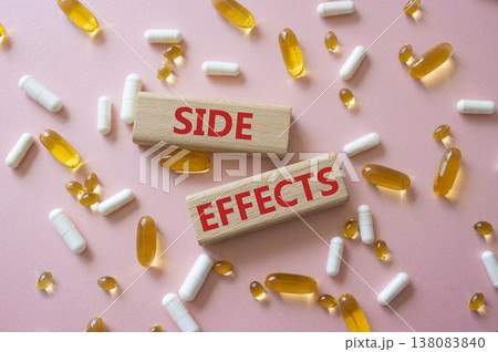 Side Effects symbol. Wooden blocks with words Side Effects. Beautiful pink background with pills. Medicine and Side Effects concept. Copy space. Side Effects symbol. Wooden blocks with words Side Effects. Beautiful pink background with pills. Medicine and Side Effects concept. Copy space. 138083840
