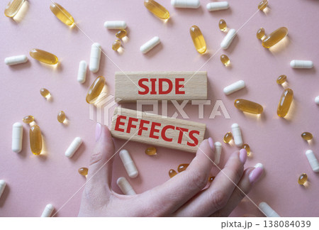 Side Effects symbol. Wooden blocks with words Side Effects. Beautiful pink background with pills. Doctor hand. Medicine and Side Effects concept. Copy space. Side Effects symbol. Wooden blocks with words Side Effects. Beautiful pink background with pills. Doctor hand. Medicine and Side Effects concept. Copy space. 138084039