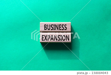 Business expansion symbol. Concept word Business expansion on wooden blocks. Beautiful green background. Business and Business expansion concept. Copy space Business expansion symbol. Concept word Business expansion on wooden blocks. Beautiful green background. Business and Business expansion concept. Copy space 138084043