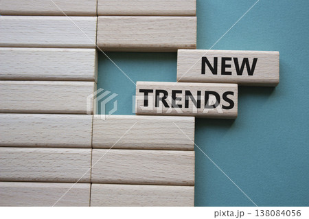 New Trends symbol. Wooden blocks with words New Trends. Beautiful grey green background. Business and New Trends concept. Copy space. New Trends symbol. Wooden blocks with words New Trends. Beautiful grey green background. Business and New Trends concept. Copy space. 138084056