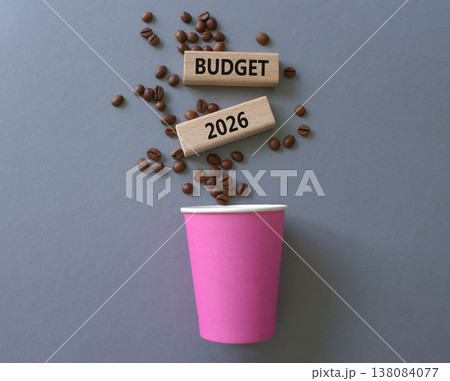 Budget 2026 symbol. Concept words Budget 2026 on beautiful wooden picture frame. Beautiful grey background with coffee cup and coffee beans. Business and Budget 2026 concept. Copy space. 138084077