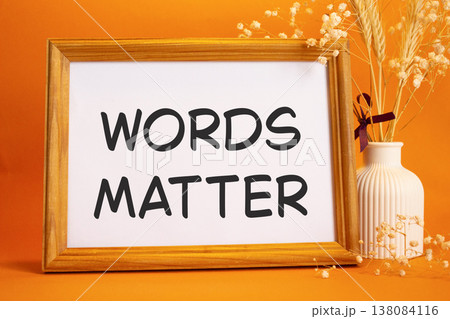 Words Matter symbol. Concept words Words Matter on beautiful wooden picture frame. Beautiful orange background with flower vase. Business and Words Matter concept. Copy space. Words Matter symbol. Concept words Words Matter on beautiful wooden picture frame. Beautiful orange background with flower vase. Business and Words Matter concept. Copy space. 138084116