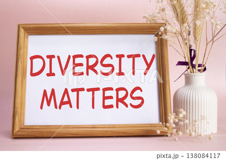 Diversity matters symbol. Concept words Diversity matters on beautiful wooden picture frame. Beautiful pink background with flower vase. Business and Diversity matters concept. Copy space. 138084117