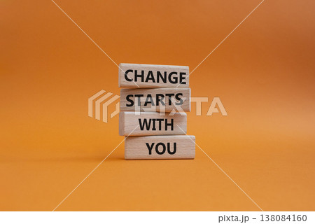 Change symbol. Wooden blocks with words Change Starts With You. Beautiful orange background. Business and Change concept. Copy space 138084160