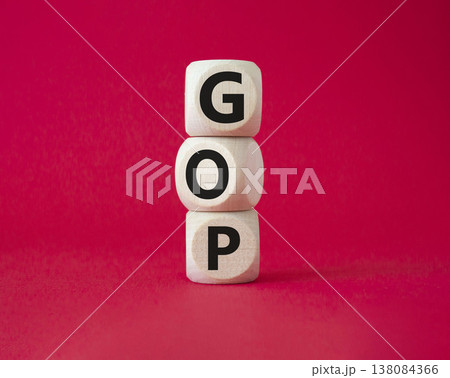 GOP - Gross Operating Profit symbol. Concept word GOP on wooden cubes. Beautiful red background. Business and GOP concept. Copy space. 138084366