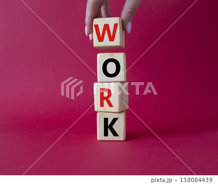 Work symbol. Concept word Work on wooden cubes. Businessman hand. Beautiful red background. Business and Work concept. Copy space. 138084439