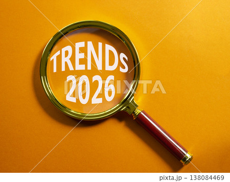 Trends 2026 symbol. Magnifying Glass with words Trends 2026. Beautiful orange background. Business and Trends 2026 concept. Copy space. Trends 2026 symbol. Magnifying Glass with words Trends 2026. Beautiful orange background. Business and Trends 2026 concept. Copy space. 138084469