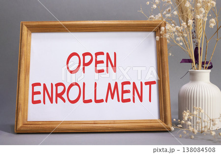 Open Enrollment symbol. Concept words Open Enrollment on beautiful wooden picture frame. Beautiful grey background with flower vase. Business and Open Enrollment concept. Copy space. 138084508
