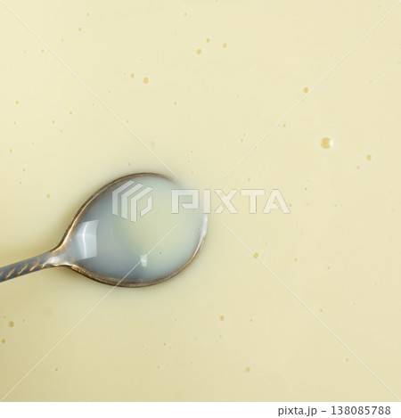 Square Cooking Background Top View Condensed Milk in Spoon. Square Cooking Background Top View Condensed Milk in Spoon. 138085788