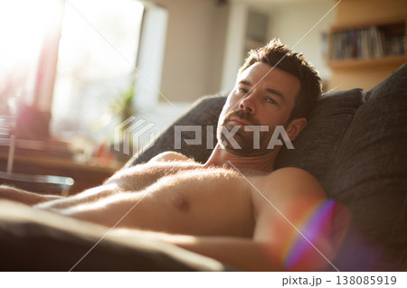 shirtless man resting on recliner, sunlit contemporary living room, relaxed and calm expression, shirtless man resting on recliner, sunlit contemporary living room, relaxed and calm expression, 138085919
