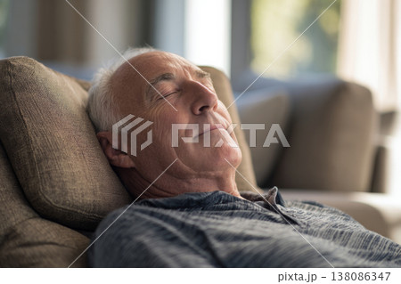 elderly man lying on recliner, sunlit bright living room, calm and relaxed mood. 138086347