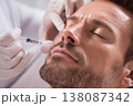 close-up of male patient receiving facial injection from experienced cosmetologist, medical gloves, 138087342