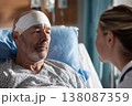 close-up of male patient with subtle facial bandage speaking with caring nurse in recovery room, 138087359