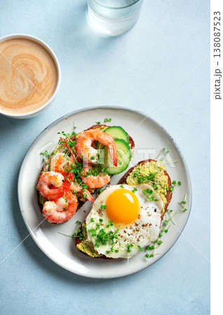 Avocado Shrimp and Fried Egg Breakfast Sandwiches 138087523