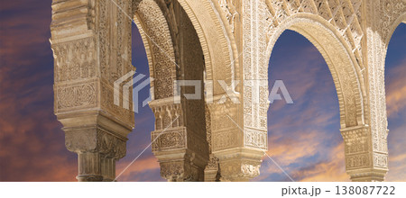 Arches in Islamic (Moorish) style (against the sunset) in Alhambra, Granada, Spain 138087722