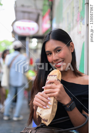 Thai Woman Eating Banh Mi Sandwich Hanoi Vietnam Thai Woman Eating Banh Mi Sandwich Hanoi Vietnam 138087867