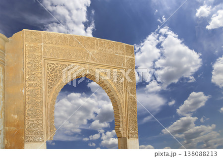 Arches in Islamic (Moorish) style (against the background of a beautiful sky with clouds) in Alhambra, Granada, Spain 138088213