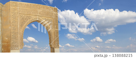 Arches in Islamic (Moorish) style (against the background of a beautiful sky with clouds) in Alhambra, Granada, Spain Arches in Islamic (Moorish) style (against the background of a beautiful sky with clouds) in Alhambra, Granada, Spain 138088215