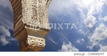 Columns in Islamic (Moorish) style in Alhambra (against the background of a beautiful sky with clouds), Granada, Spain Columns in Islamic (Moorish) style in Alhambra (against the background of a beautiful sky with clouds), Granada, Spain 138088247