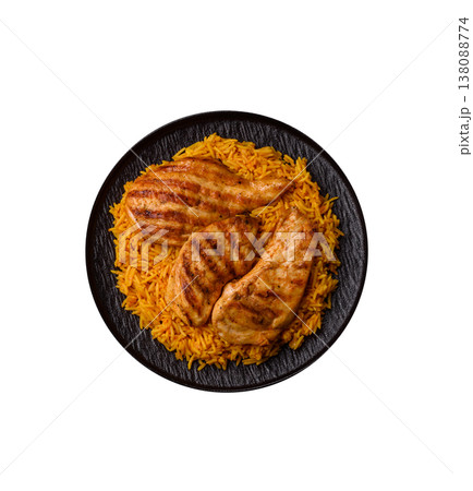 Kabsa or haneeth, an Arabic dish with rice and chicken, salt, and spices. Kabsa or haneeth 138088774