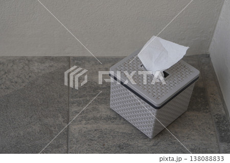 top view gray and black plastic tissue boxes sit on the grey tiled floor and white wall background, clean, object, decor, ancient, fashion, copy space top view gray and black plastic tissue boxes sit on the grey tiled floor and white wall background, clean, object, decor, ancient, fashion, copy space 138088833