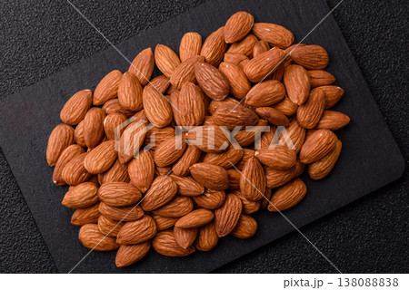 Raw and peeled almonds as a healthy food ingredient. Almonds as a food background Raw and peeled almonds as a healthy food ingredient. Almonds as a food background 138088838
